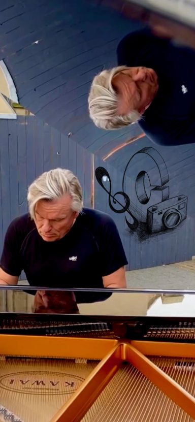 Carsten Esser konzentriert am offenen Flügel auf der Kölner Schildergasse.